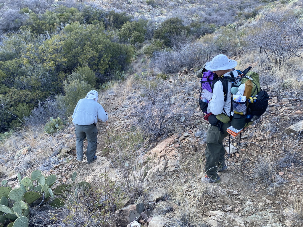 2022/01(January)/BigBend-Hiking/1024x768_2022-01-14-Big-Bend-Camping-Crew8787-67-Travis-helping-with-Carls-backpack.jpg