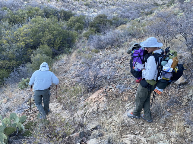 2022-01-14-Big-Bend-Camping-Crew8787-66-Travis-helping-with-Carls-backpack-GOOD.jpg
