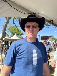 2023/04(April)/Two-StepInn-Festival-Georgetown-TX/2023-04-15-Two-Step-Inn-Festival-01-Travis-trying-a-hat.JPG