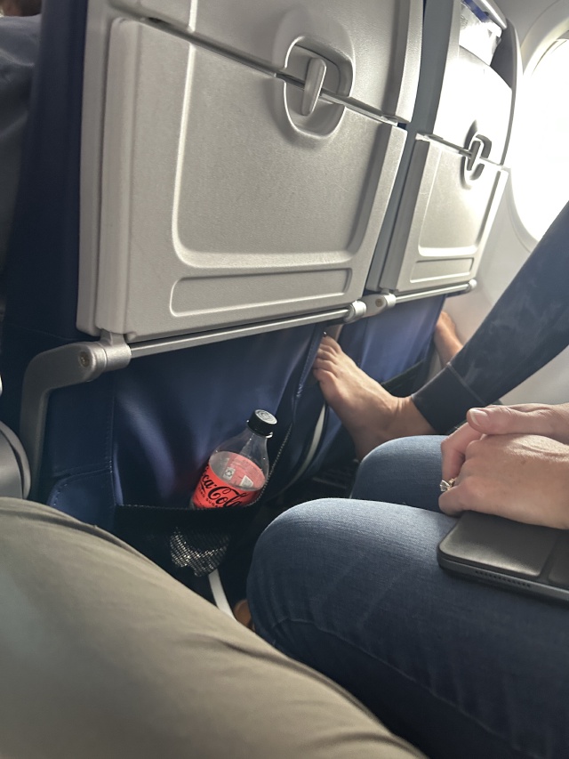 2023-05-30-Colorado-4-feet-on-airplane.JPG