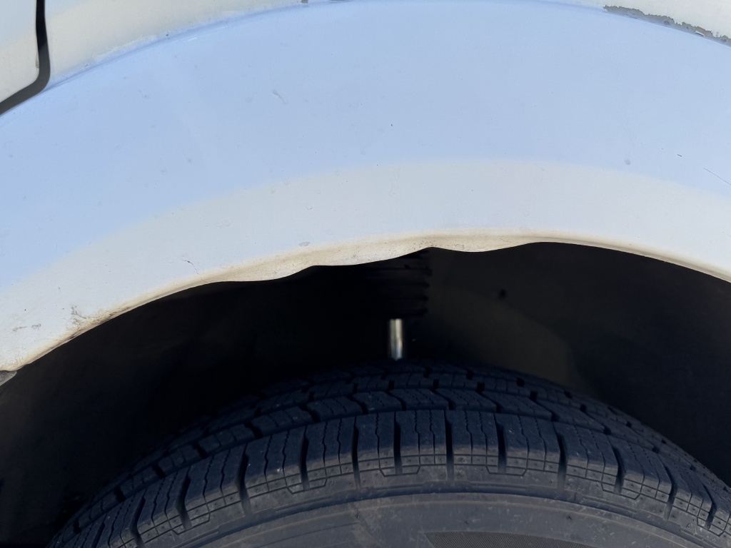 2024-09-27-Sprinter-02-Bent-Wheel-Well-during-front-Shock-Replacement.JPG