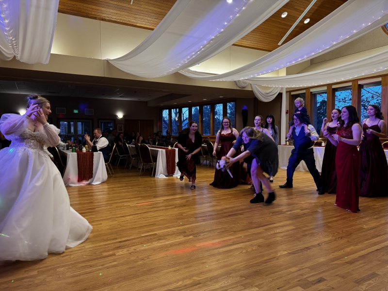 2025-11-08-McKenzie-BenBeatty-Wedding-096-boquet-toss-Zeta-GOOD-GOOD.JPG