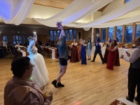 2025-11-08-McKenzie-BenBeatty-Wedding-099-boquet-toss-Zeta.JPG