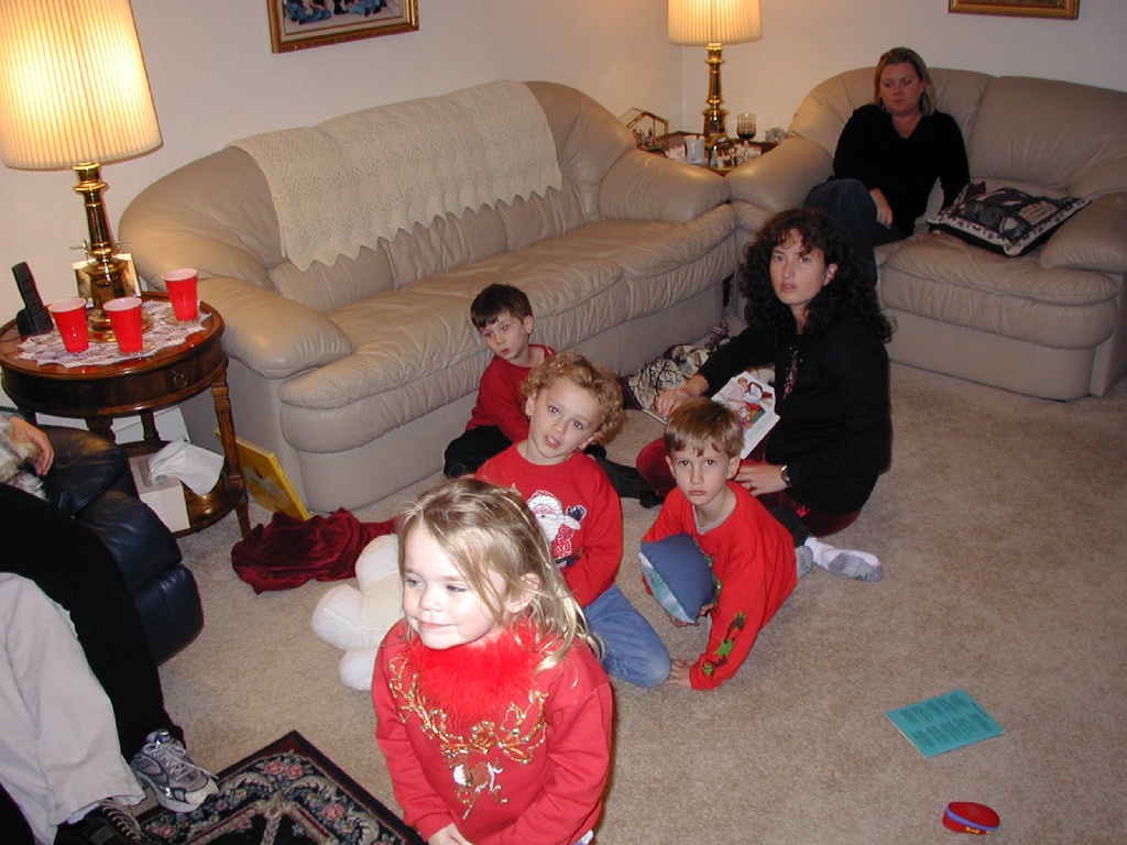 2004-12-24-Christmas-Eve-06-Suzi-reading-to-Vale-Kyla-Chance-Dax-Katie.JPG