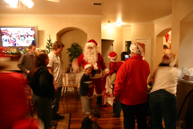 2006-12-24-Christmas-Eve-80-Santa-Justin-Katie-Justin-Chance-Dax-Ian-Heather-Jim-Suzi.JPG