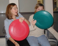 2002-12-24-Xmas-25-Heather-Katie-sitting-cushions.JPG