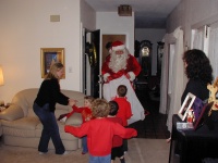 2004-12-24-Christmas-Eve-08-Santa-Chance-Dax-Vale-Kyla-Katie.JPG