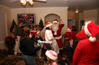 2006-12-24-Christmas-Eve-78-Santa-Justin-Katie-Chance-Suzi-Kyla-Dax-Ian-Heather-Janeen.JPG