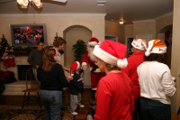 2006-12-24-Christmas-Eve-79-Santa-Justin-Katie-Justin-Chance-Janeen-Jim-Suzi.JPG