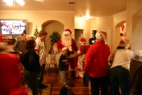 2006-12-24-Christmas-Eve-80-Santa-Justin-Katie-Justin-Chance-Dax-Ian-Heather-Jim-Suzi.JPG