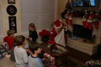 2007-12-24-Christmas-Eve-09-Santa-Katie-Ian-Chance-Dax.JPG